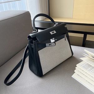 Kelly style bag crossbody in black and canvas